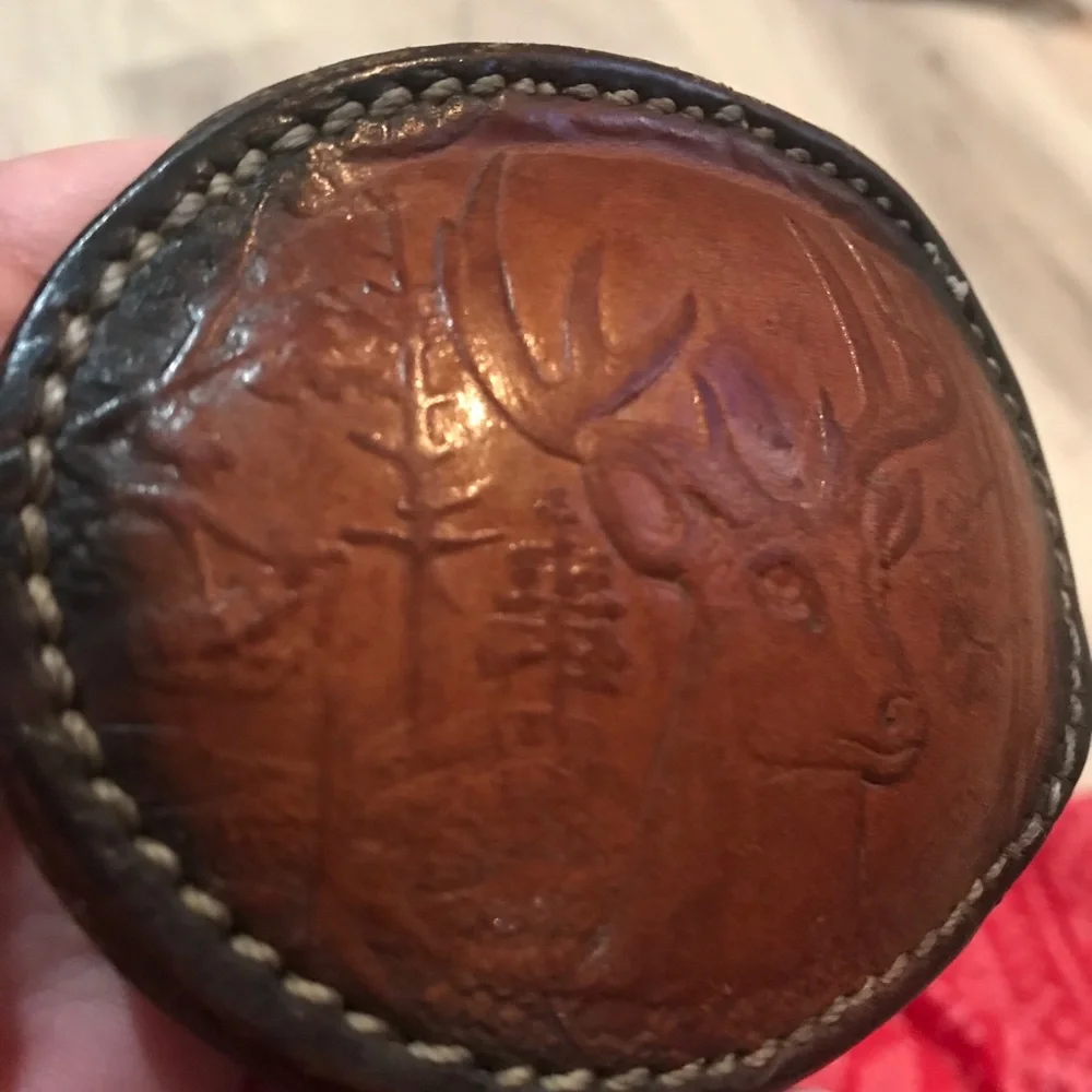 - Handcrafted leather seat belt buckle in brown